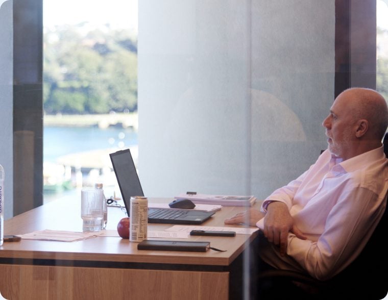 Broker at a desk by the window